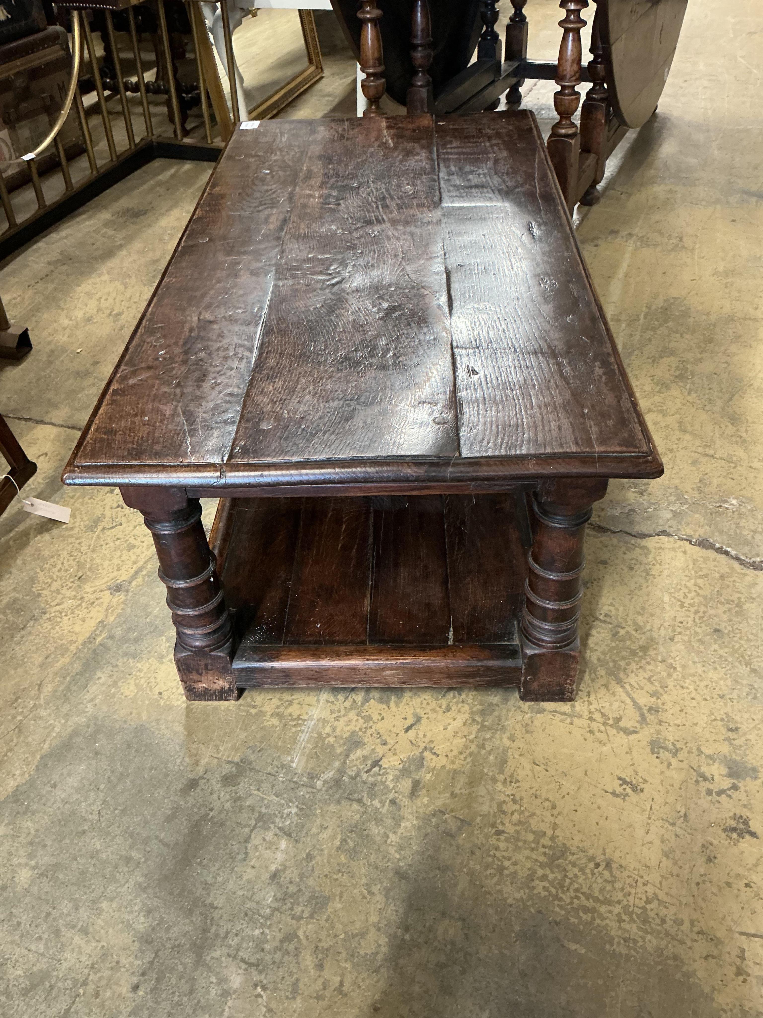 A 17th century style rectangular oak two tier coffee table, width 106c, depth 55cm, height 43cm